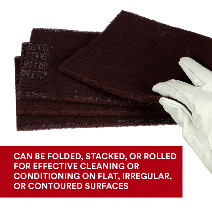 3M Scotch-Brite 7447 general purpose hand pads, maroon very fine non-woven pads, 6x9 inches, stacked and rolled.