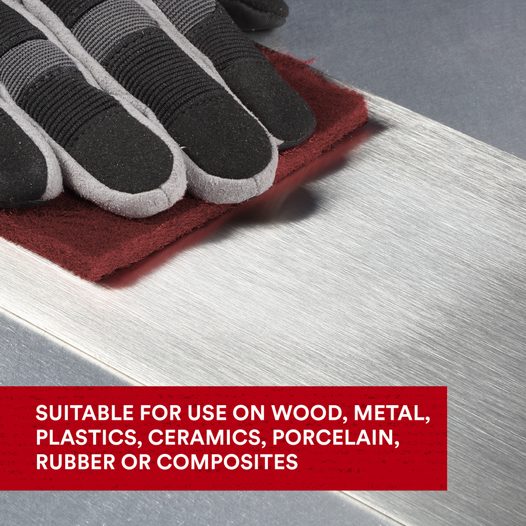 3M Scotch-Brite 7447 general purpose hand pads in maroon, non-woven, very fine, 6x9 inches, shown in case of 60 pads