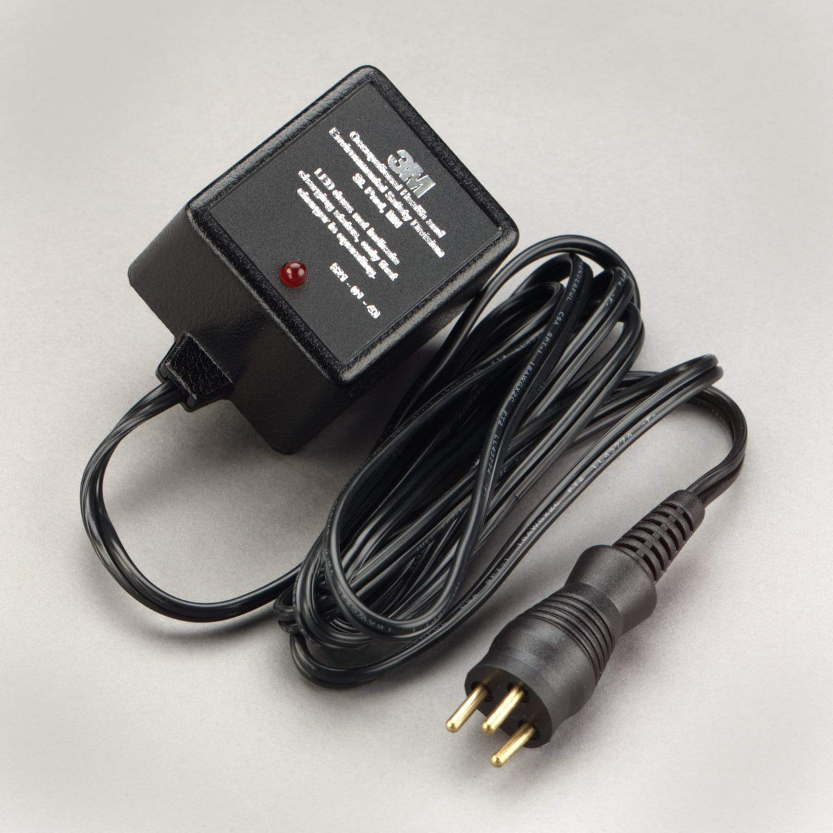3M Battery Charger 7000126390, model 521-01-43R01, with charging ports and power cord for rechargeable batteries.