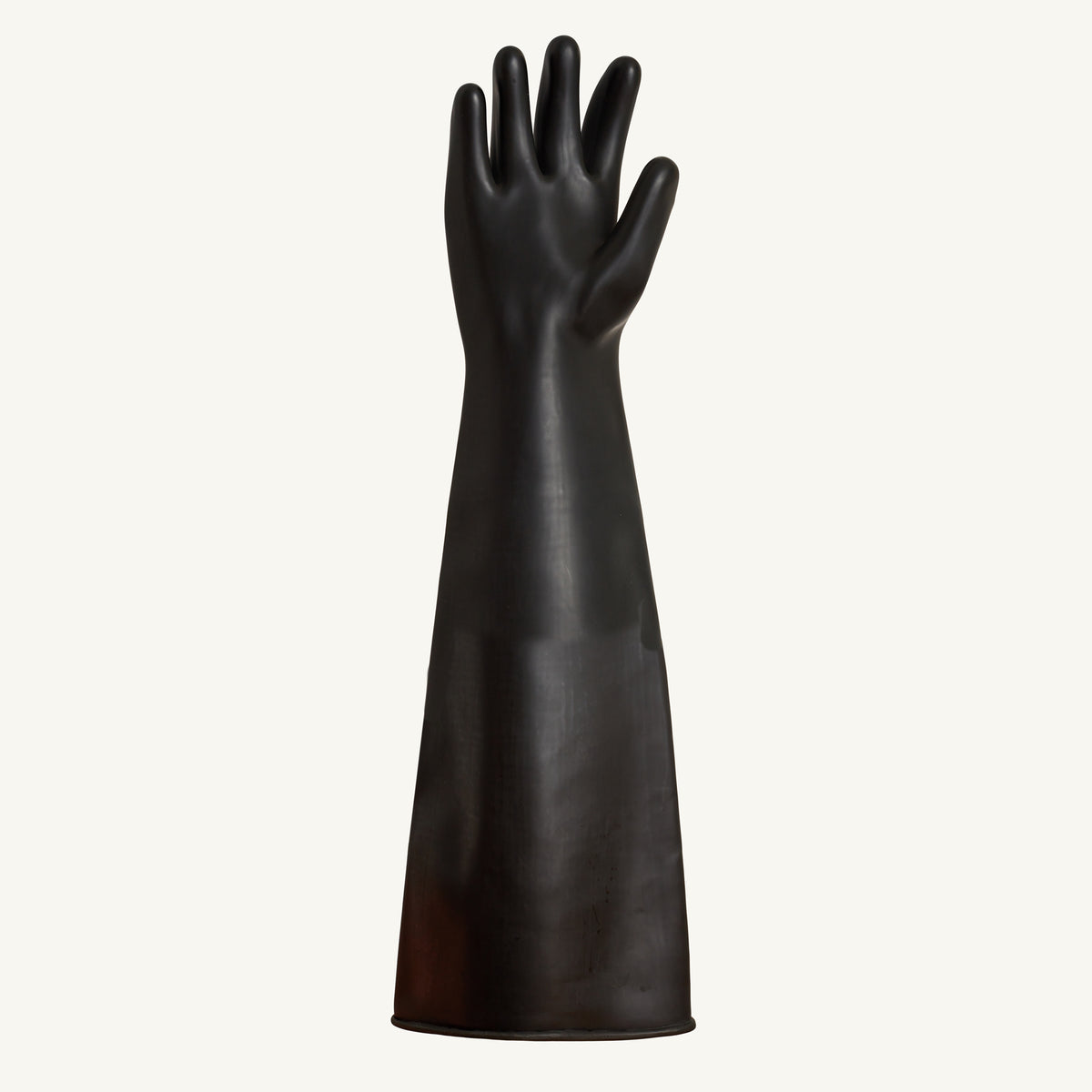 Black natural rubber sandblasting glove by Superior Glove, 60cm length, showing the palm and textured surface for protection.