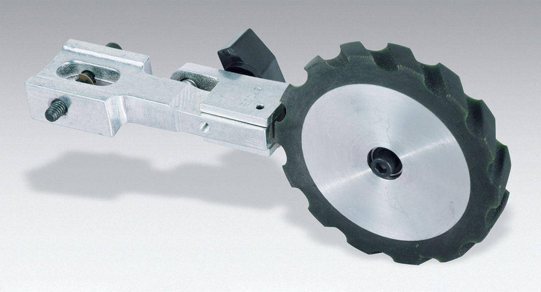 Dynabrade utility arm with 4x1/2 inch wide serrated urethane surface, durable and versatile for industrial tool setups.