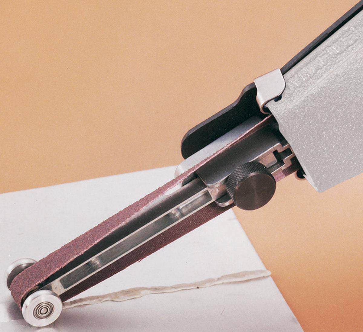 Dynabrade 11297 contact arm assembly with 5/8 inch rubber wheel and guiding wheels, designed for industrial abrasive tools.