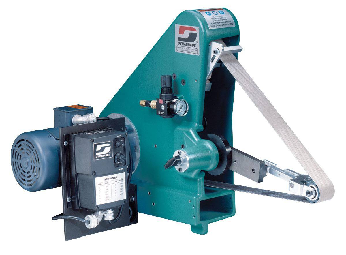 Dynabrade 64861 variable speed grinder with slack-action, 1 HP, 240V, for 1/4 to 2-inch belts, shown with belt and tool in use.