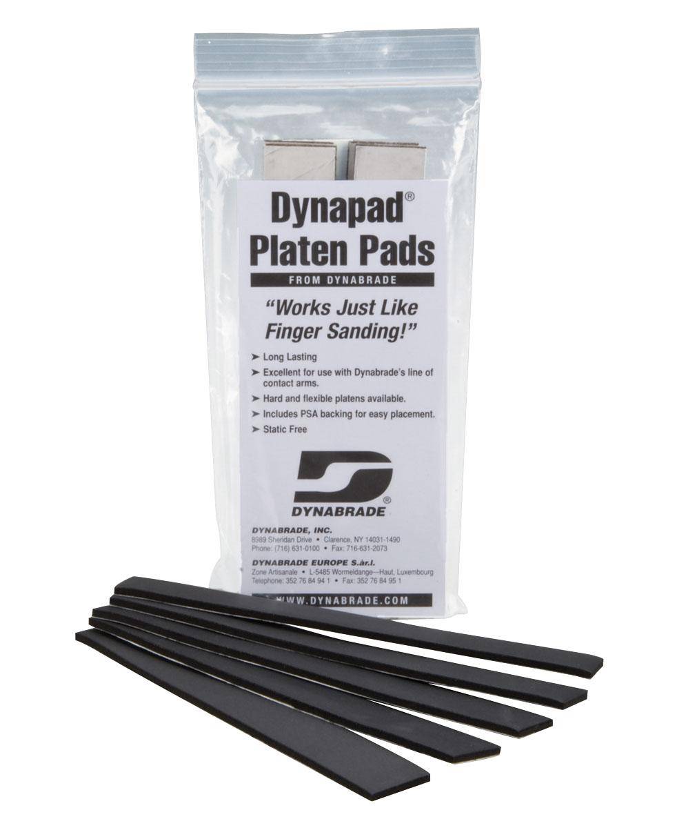 Set of five Dynabrade Dynapad 11109 hard cork pads, durable abrasive tool parts for surface finishing and polishing.