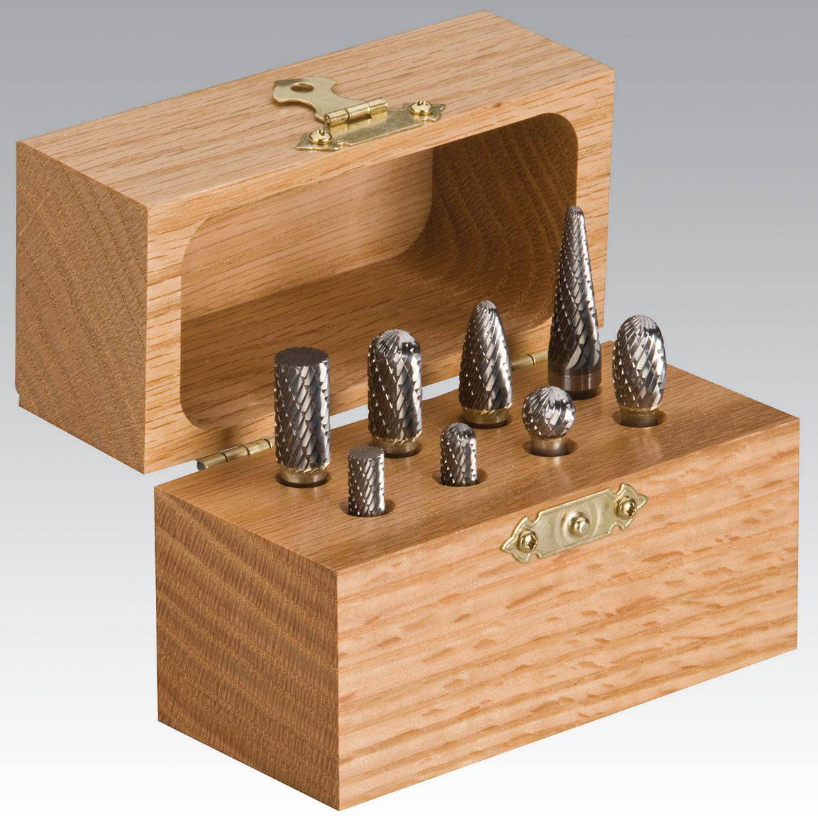 Dynabrade 93350 8-piece carbide burr kit with 1/4 inch shaft for metal grinding and shaping, includes various burr types.