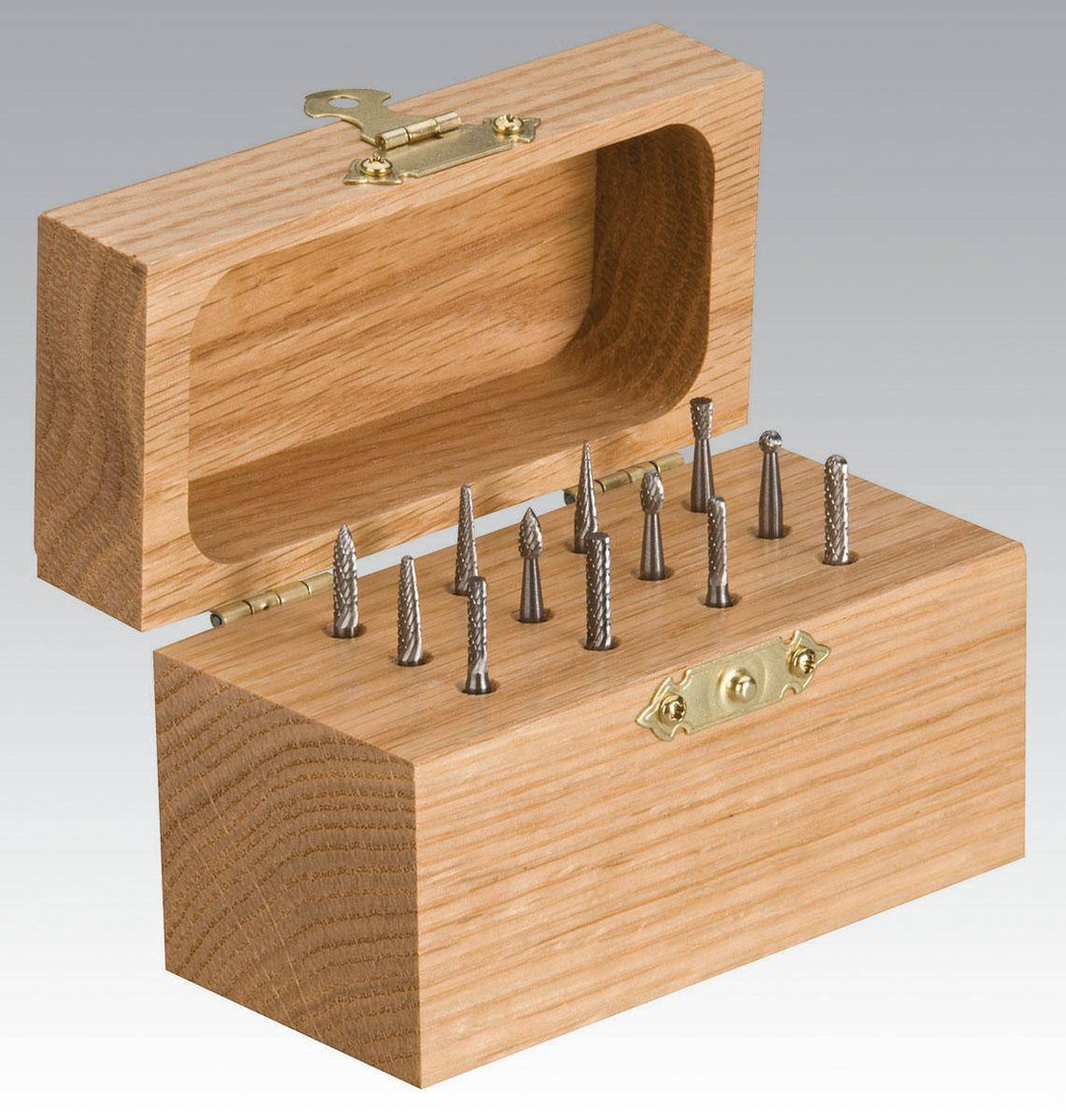 Dynabrade 93351 12-piece carbide burr kit with 1/8 inch shaft, includes various regular carbide burrs for metal grinding and shaping.
