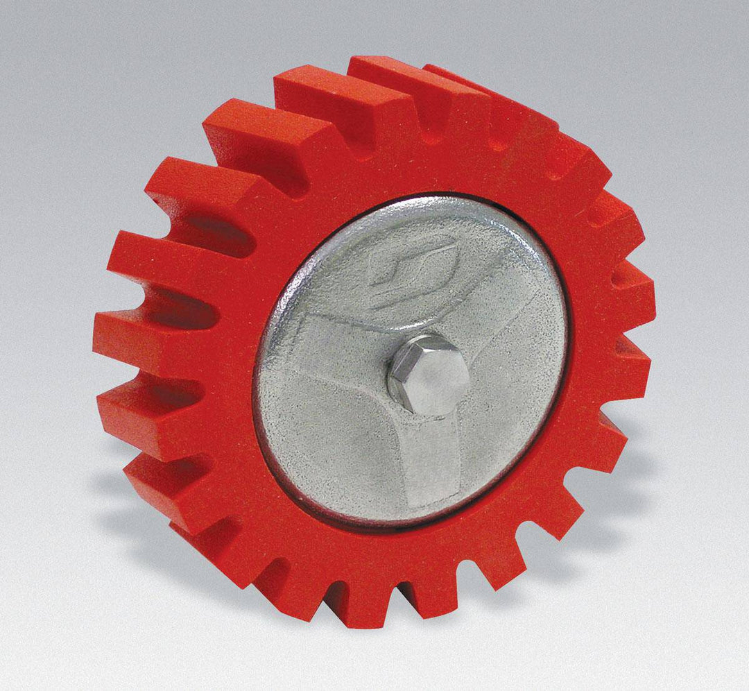 Dynabrade 92257 Red-Tred Eraser Wheel, 4-inch diameter by 1-1/4-inch wide, used for surface cleaning and finishing.